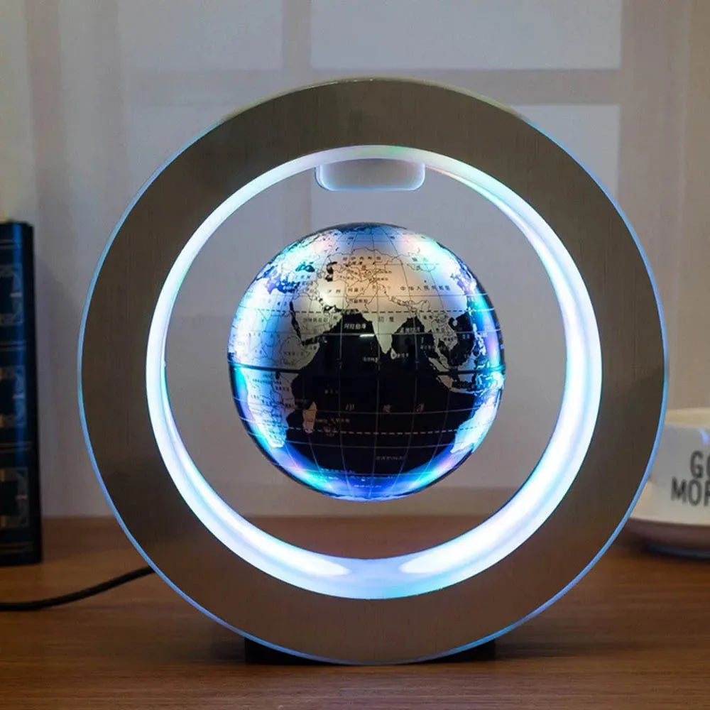 Lampe avec un globe terrestre bleu flottant par lévitation magnétique, entouré d'un anneau lumineux en ABS.