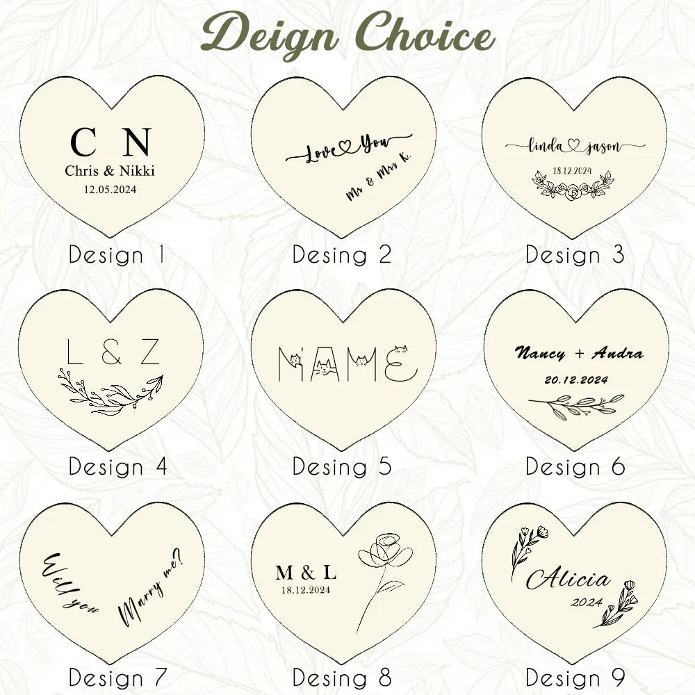 Image présentant neuf options de gravure personnalisée pour une boîte à bague en bois en forme de cœur, avec divers motifs et