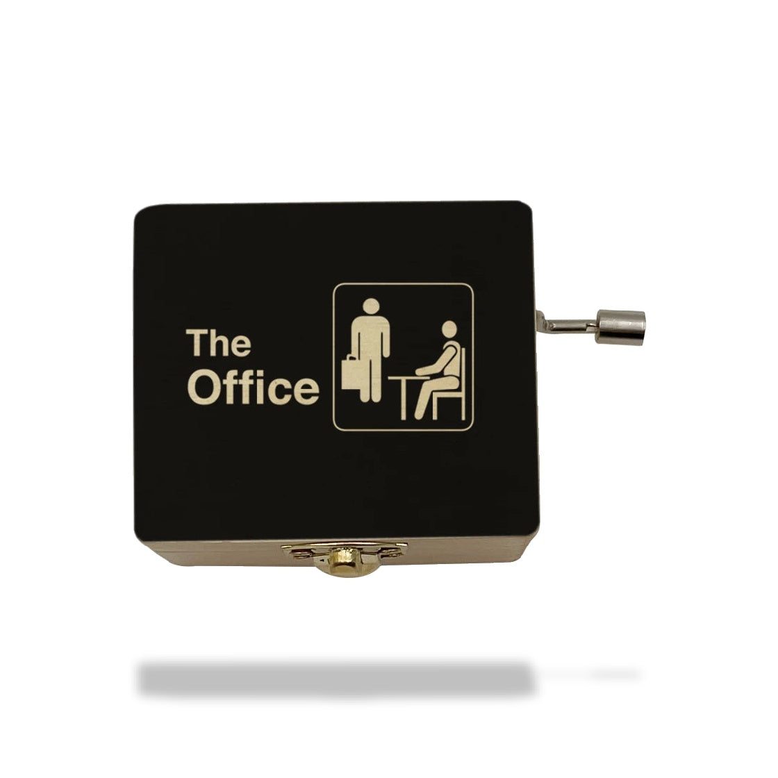 Boîte à musique noire en bois avec couvercle marqué "The Office" et pictogrammes d'employés, manivelle latérale.