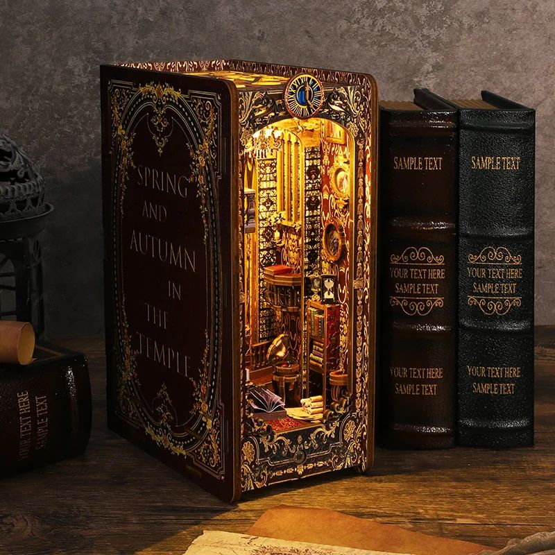 Kit serre-livres avec lumières LED. Reproduction miniature d'un intérieur de temple avec des détails dorés et le texte "SPRIN