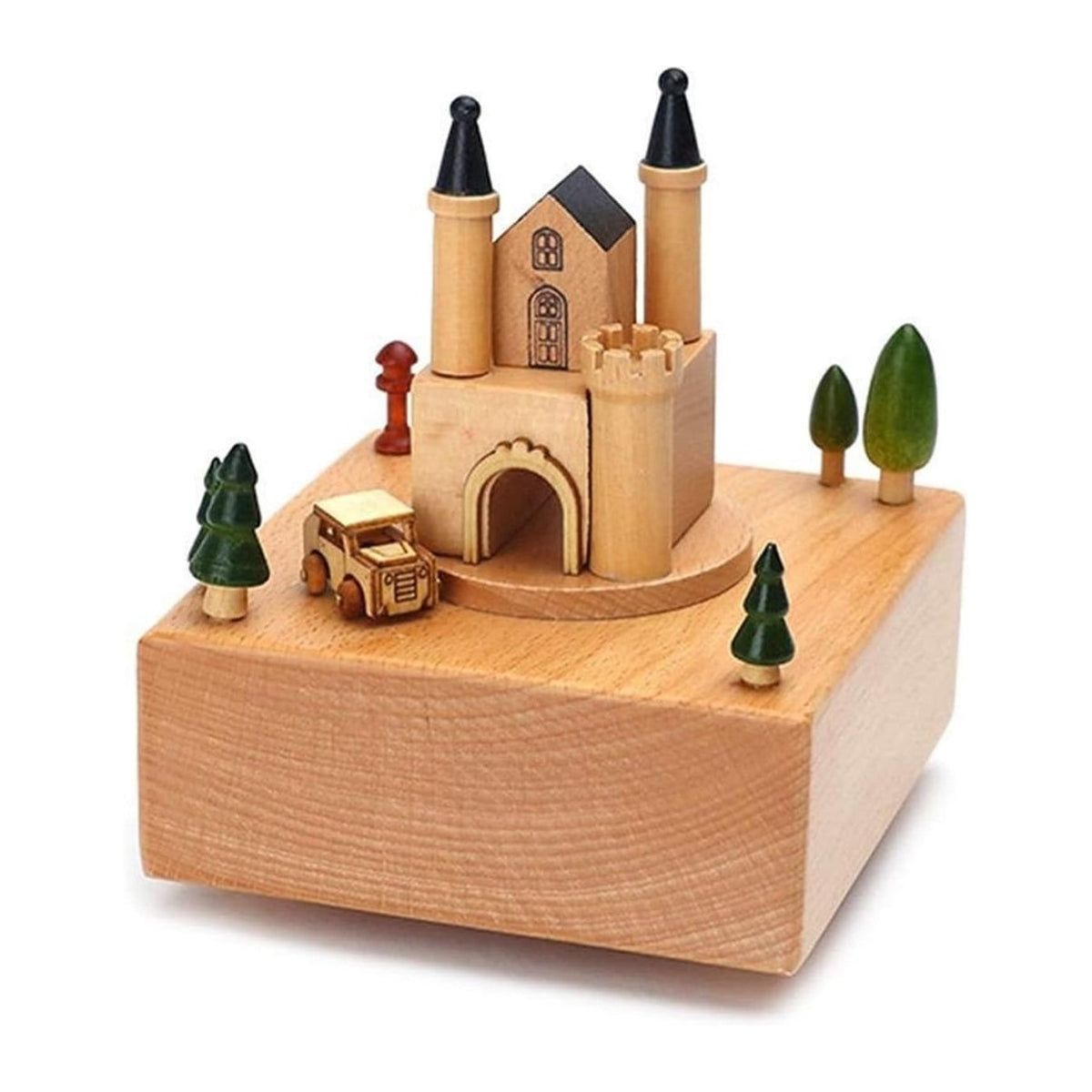 Boîte à musique en hêtre clair avec un château à tourelles noires et une voiturette jaune en mouvement.
