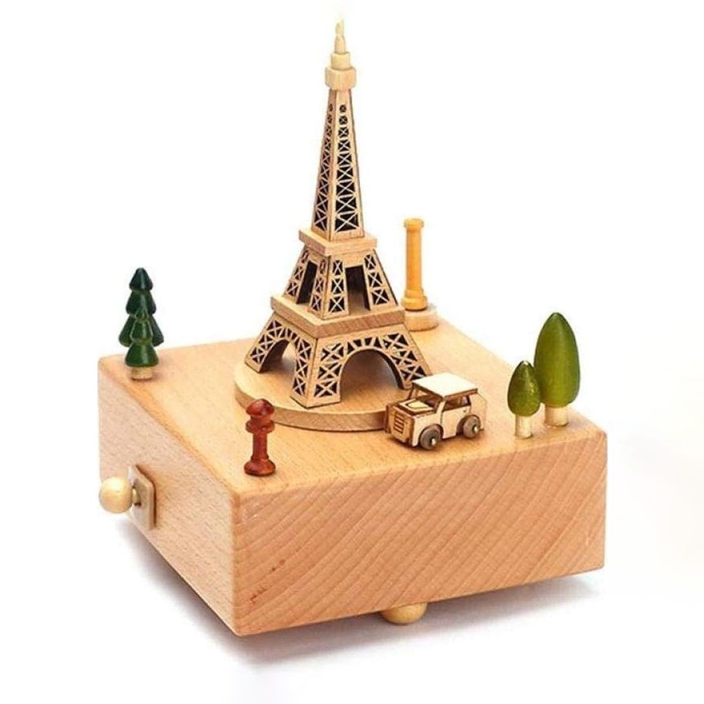 Boîte à musique en hêtre clair avec la Tour Eiffel et une voiture miniature sur le dessus, jouant la mélodie Encounter.