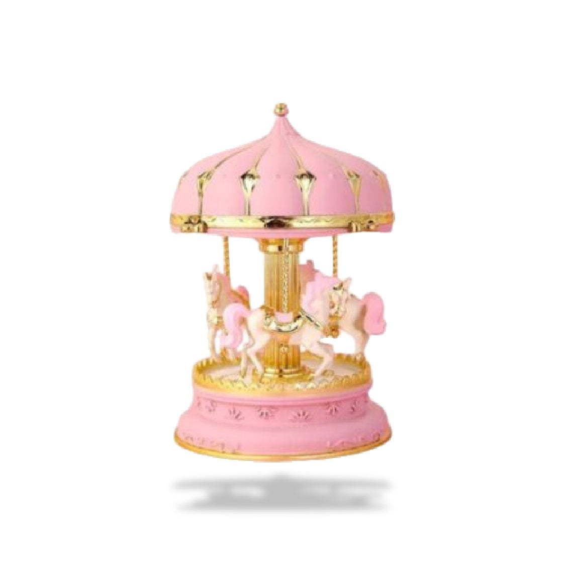 Boîte à musique carrousel rose avec des chevaux blancs. Le toit et la base sont roses avec des motifs dorés.