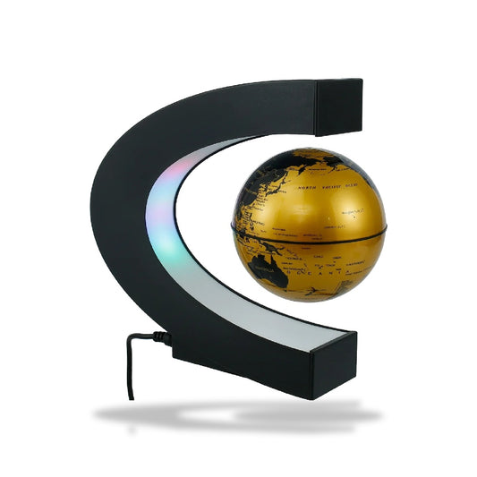 Lampe LED avec un globe terrestre doré flottant grâce à la lévitation magnétique, éclairée par des lumières colorées.