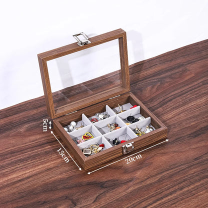 Boîte à bijoux rectangulaire en bois de noyer marron foncé avec couvercle vitré ouvert, 9 compartiments et bijoux à l'intérie