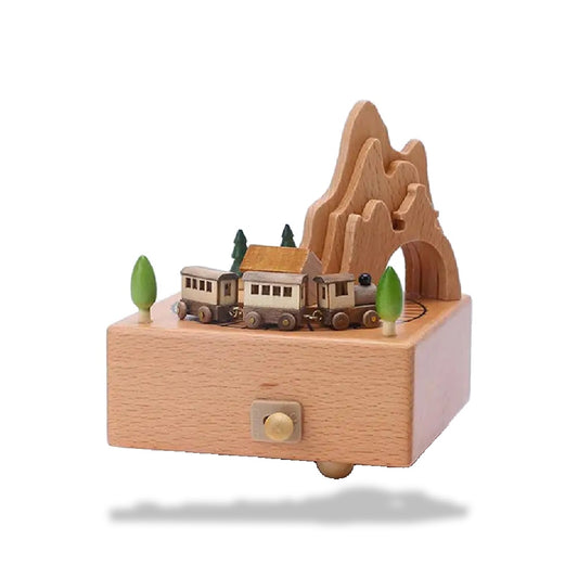 Boîte à musique en bois de hêtre, représentant un train miniature entrant dans un tunnel de montagne.