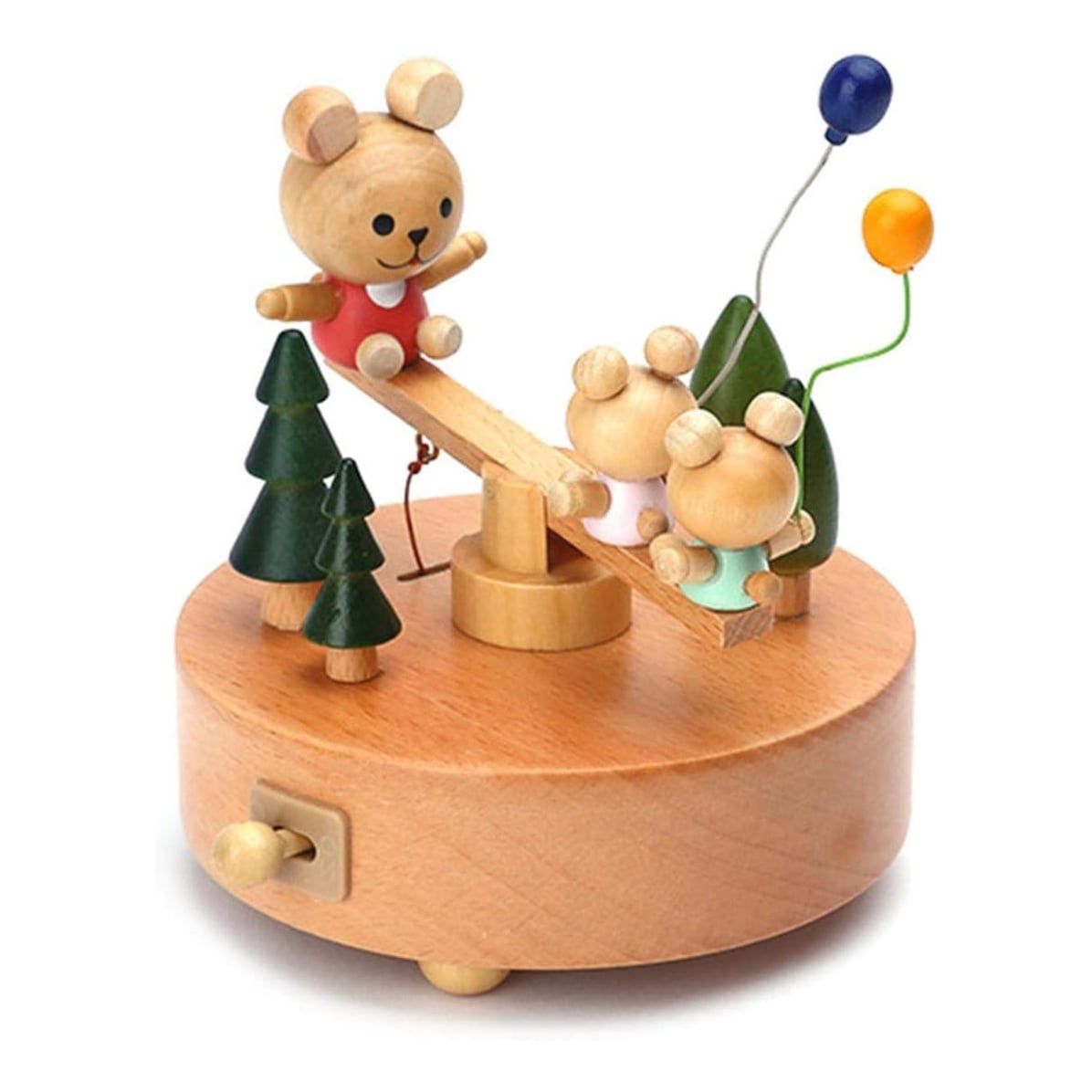 Boîte à musique en hêtre. Un grand ours et deux petits sont sur une balançoire, entourés de sapins et ballons.